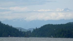 Snow peaks magically appear on top of the clouds