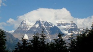 Mount Robson,  with its head in the clouds