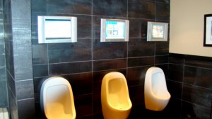 How about urinals with private TV screens?  Gotta entertain the boys...  